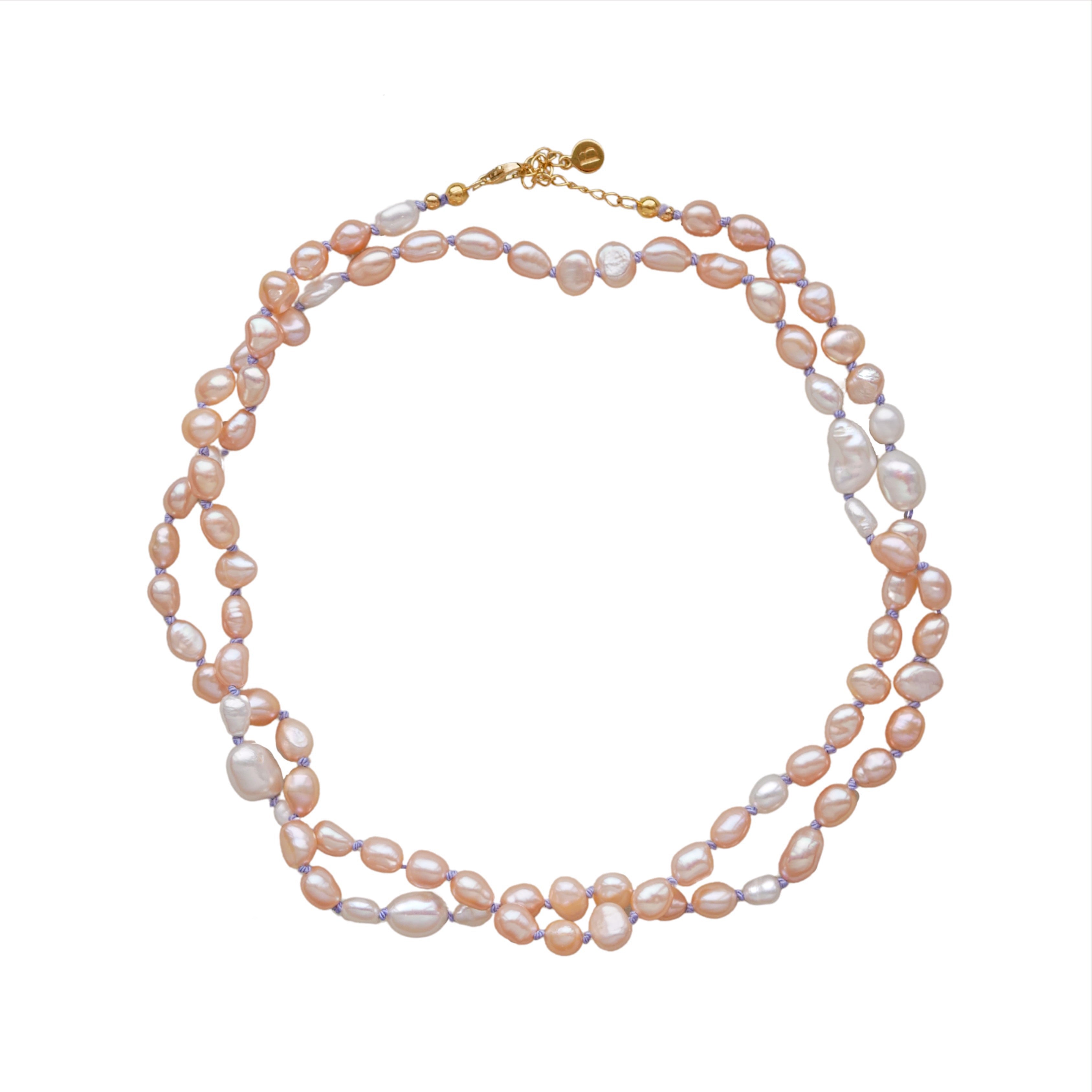 long peach and white pearl necklace