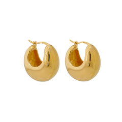 A pair of gold-colored hoop earrings with a curved design.