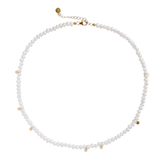 A choker necklace with hand-strung freshwater pearls and tiny gold discs, displayed against a white background