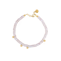 A bracelet with rose quartz beads and gold-colored discs, clasp visible, against a white background.