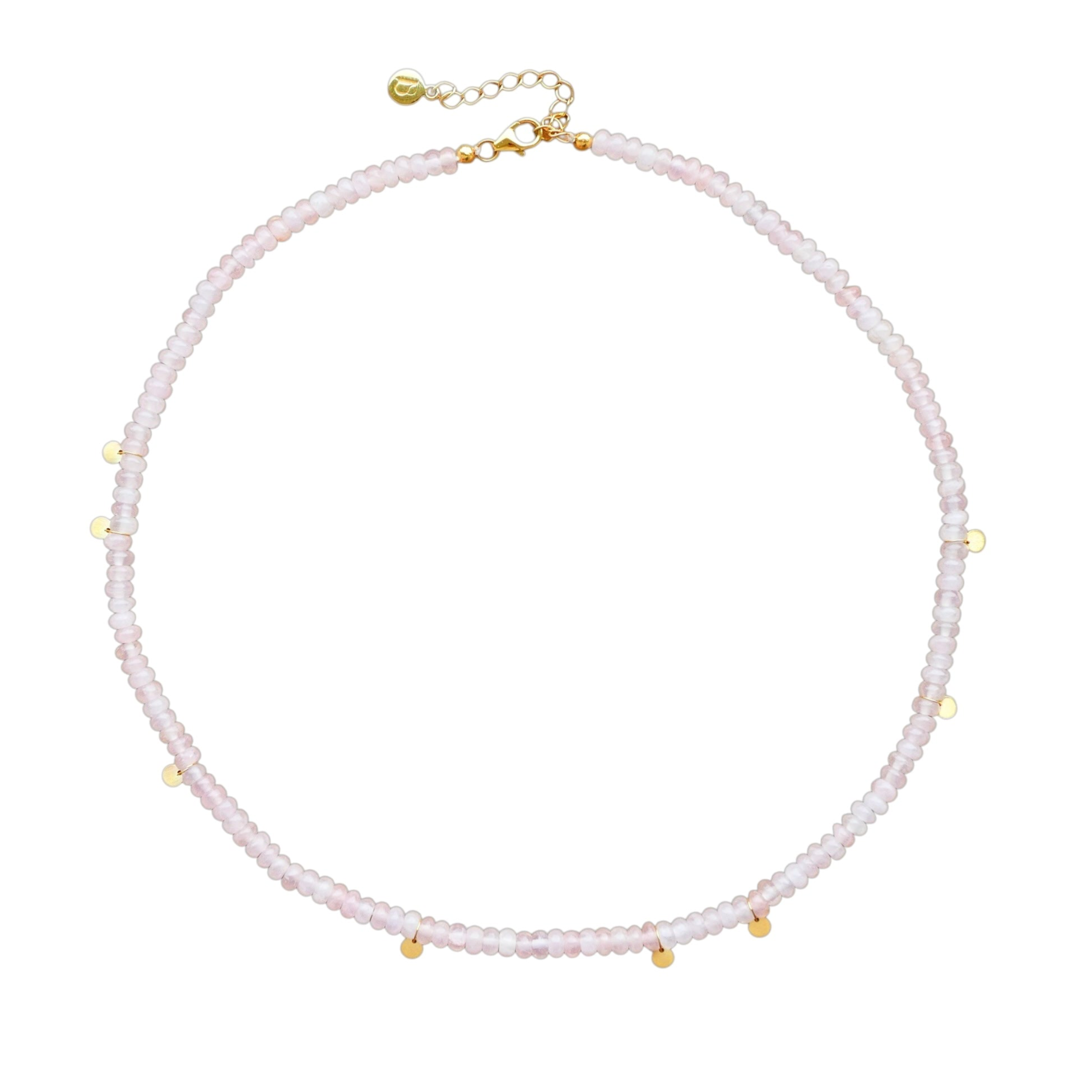 A choker necklace with rose quartz beads and gold-tone discs, displayed against a white background