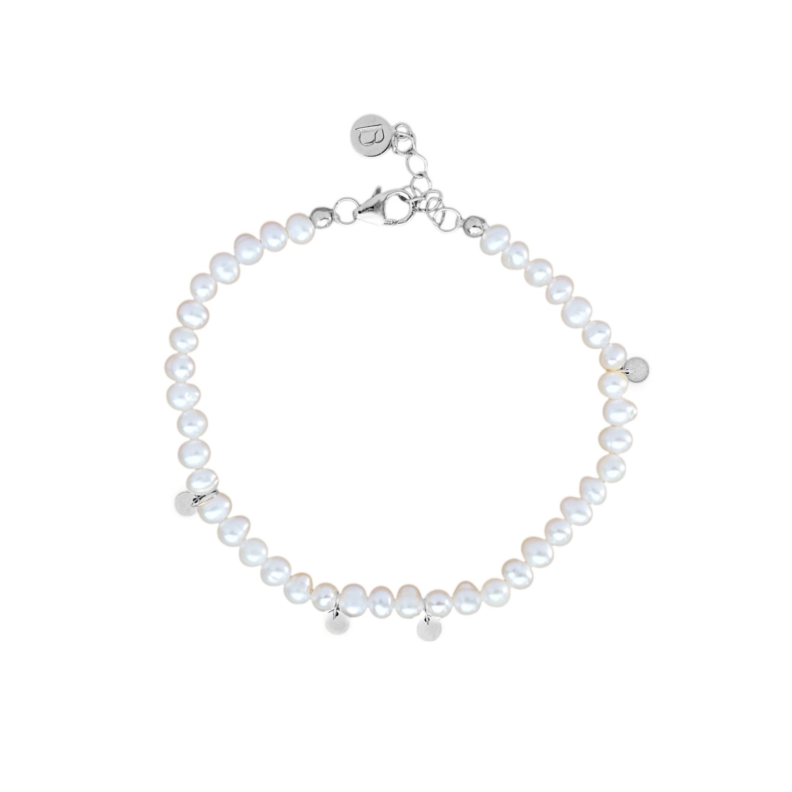 Pearl bracelet with silver clasp on a white background