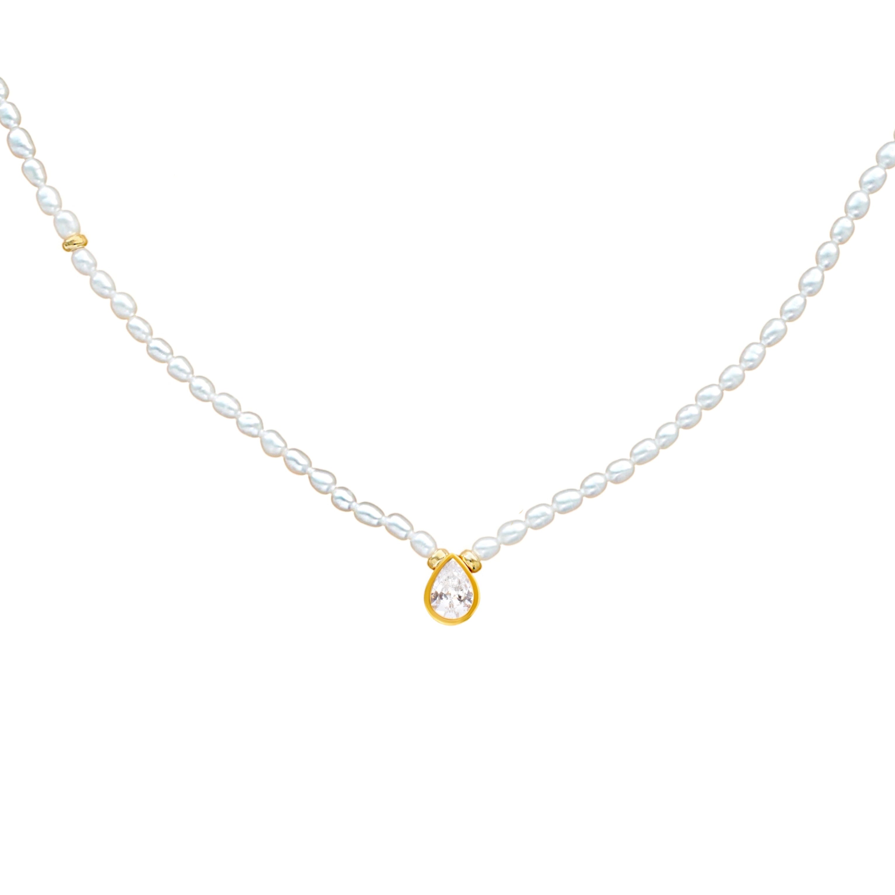 Pearl necklace with a gold pendant on a white background