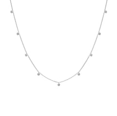 Silver necklace with small beads on a white background