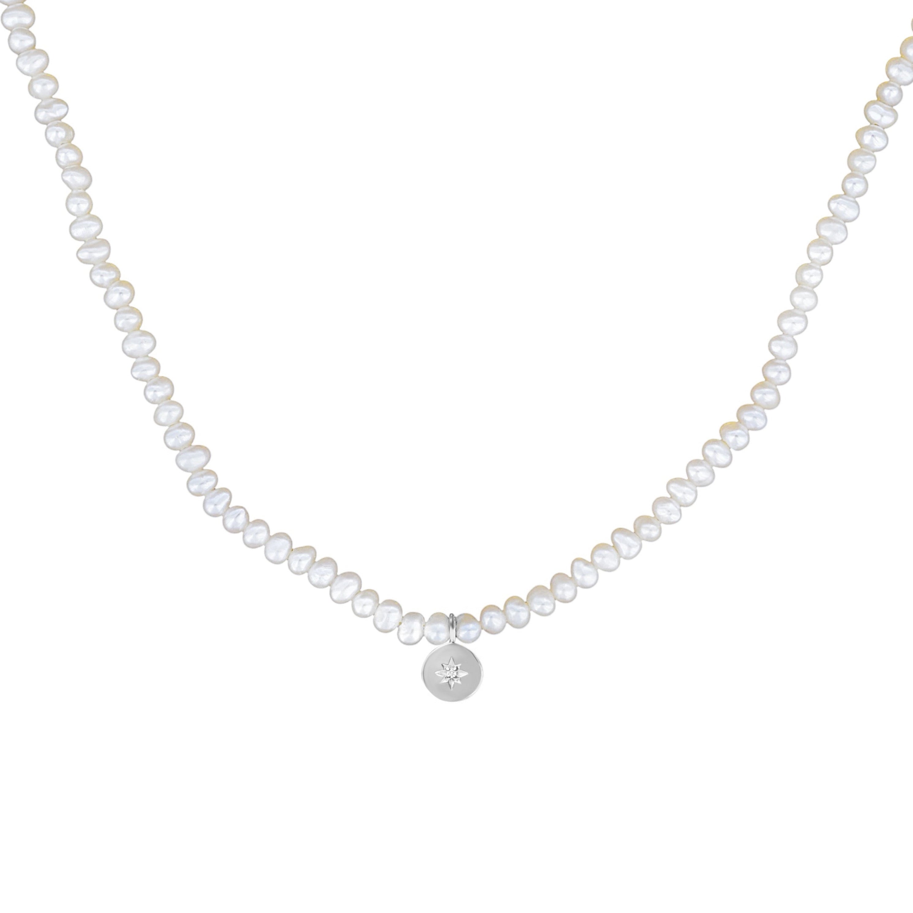 Pearl necklace with a silver pendant on a white background