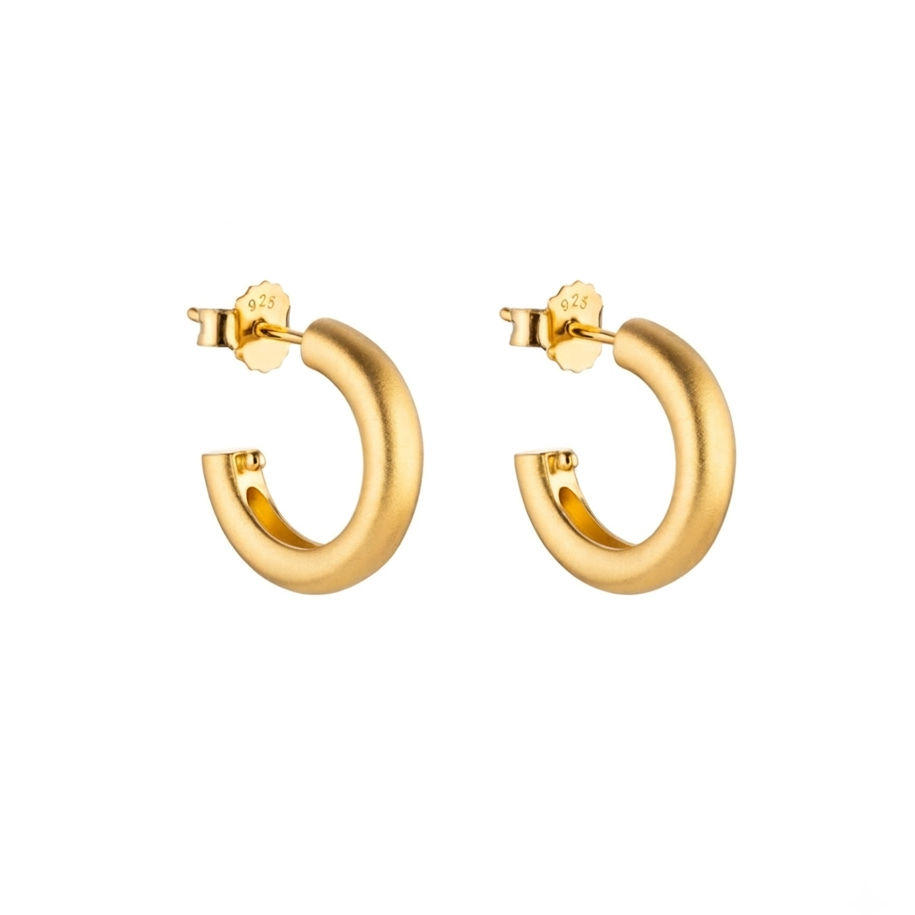 Gold hoop earrings on a white background