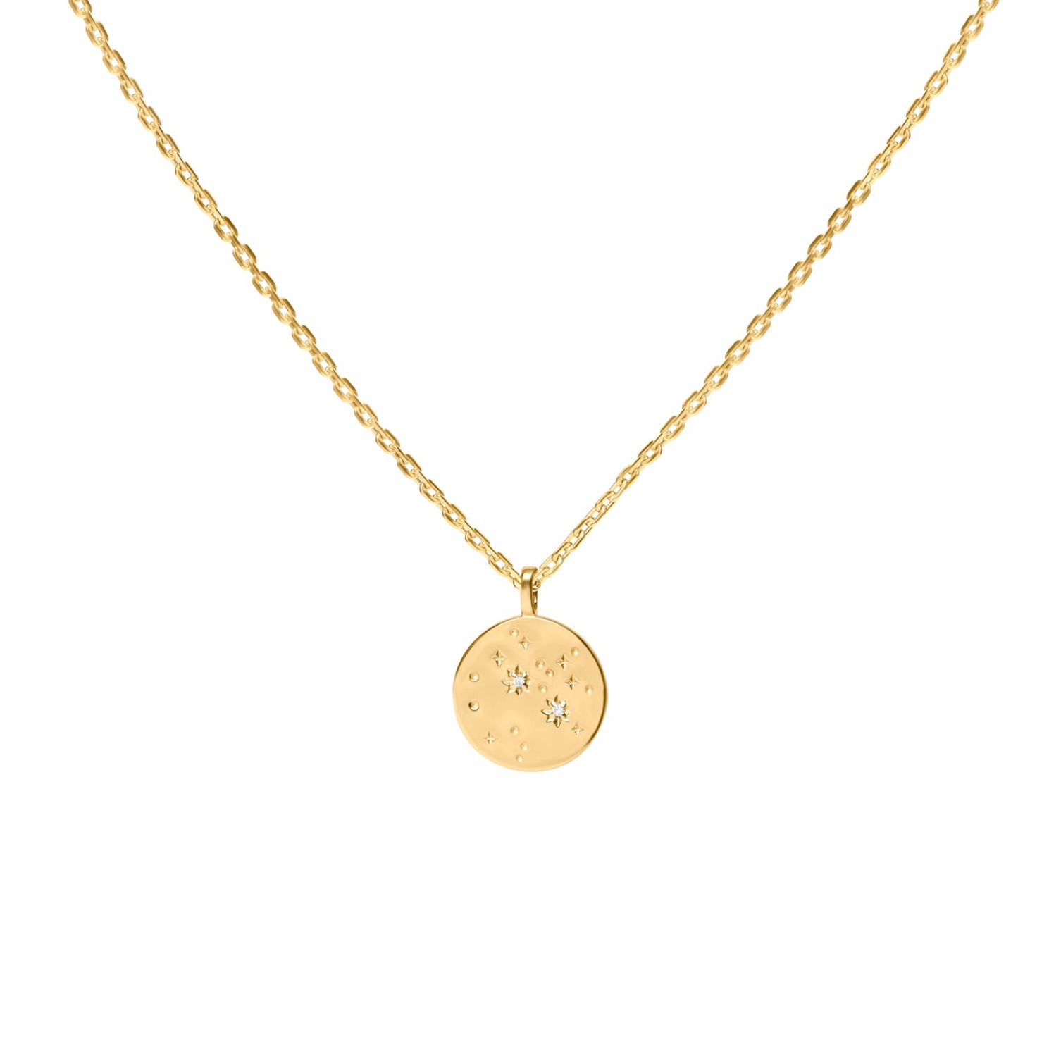 Gold necklace with a round pendant with star constellation on a white background
