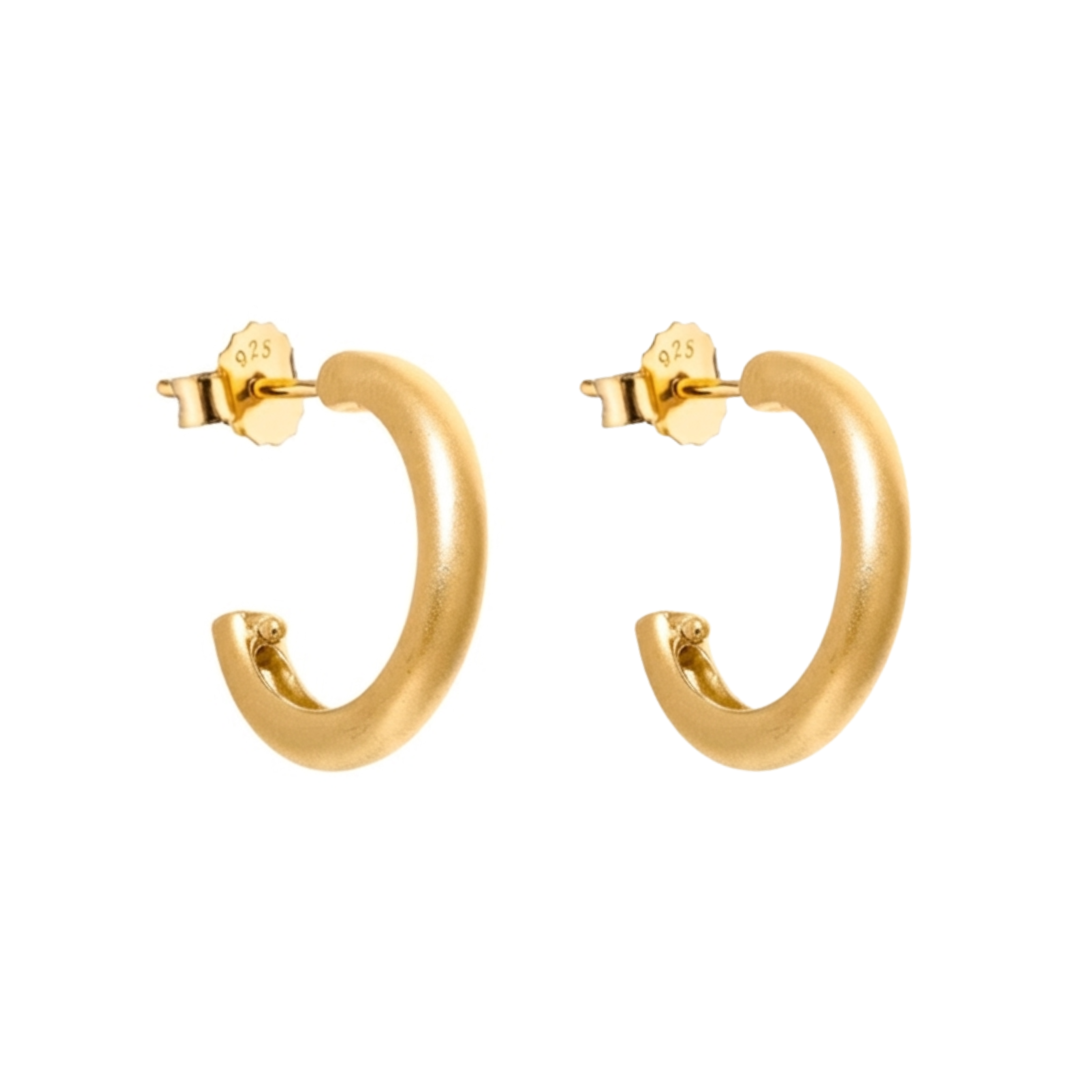Gold hoop earrings on a white background